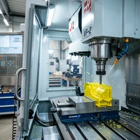 CNC automatic press operating on custom plastic insulation sheet parts
